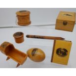 A Selection of Mauchline ware to include cradle, wood work pencil, Calendar book and trinket boxes