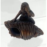 A Hand carved Japanese netsuke of a mermaid on a shell. Signed.