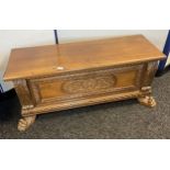 A Reproduction antique style linen chest with carved claw feet supports [52x128x42cm]