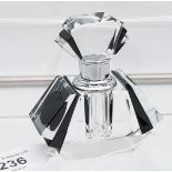 A glass art deco style perfume bottle