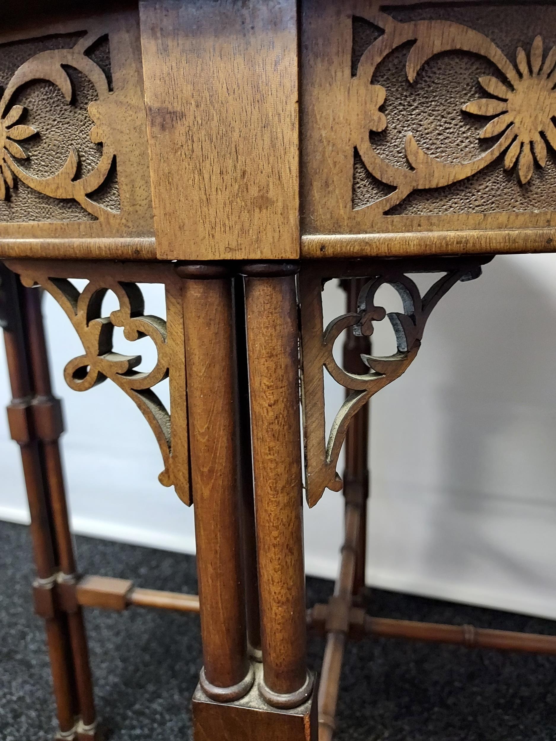 A 19th century barrel window table with glass top above a carved frieze, - Image 5 of 5