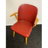 A Mid century Danish style chair. Original red vinyl covering