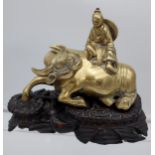 An Antique heavy Bronze/ Brass Chinese man astride a water buffalo, designed with a hand carved