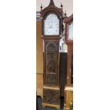 A Unique Antique long cased grandfather clock depicting a hand carved casing which shows Richard