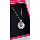 A silver & CZ pendant necklace with central amethyst panel