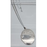 A large silver locket and chain.