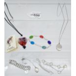 A Selection of silver jewellery to include charm gate bracelet, locket pendants with chains and