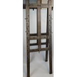 An Antique Large artists easel stand. Showing hand painted Initials to the top. 'N.G.' [Possibly the