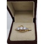 An 18ct gold ladies ring set with three large diamonds. [1ct in total]