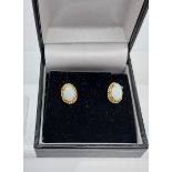A Pair of 9ct gold and opal earrings.