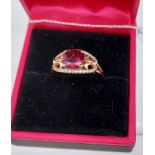 A 14ct rose gold garnet & diamond ring [3.85g]