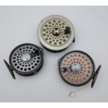 Three various fly reels with line.