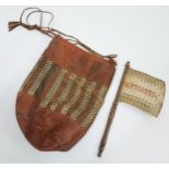 Tribal leather, weaved carry bag and swat/ brush?