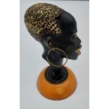 Possible Karl Hagenauer Bronze head sculpture sat upon a butterscotch amber base.