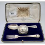 A Boxed London silver three piece Christening set. Fork, spoon and napkin ring.