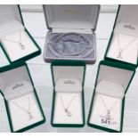 5 Silver Initial pendants with chains together with a silver bangle.