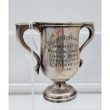 Sterling Silver small two handle trophy. Engraved 'Jute Mills [Henderson Group] Lawn Tennis Clubs,