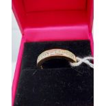 An 18ct yellow gold diamond half eternity ring [60 points approx] [4.33g] [Ring size N]