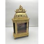 A gold painted Metal and Stainglass panel lantern, fitted with a painting of a galleon to the