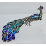 A silver & plique a jour peacock brooch [8.96g]