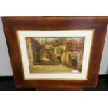 An original oil painting on canvas depicting town buildings, signed by the artist.