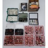 A large selection of fishing flies, fly boxes and fly line.