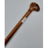 Antique walking stick designed with a hand carved hand in the form of a sheep head. [86.5cm in