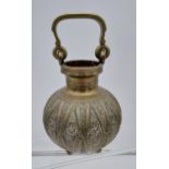 An Antique Middle Eastern brass & copper swing handle urn vase.
