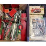 A Box containing a selection of various Meccano parts, magazines and instructions.