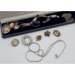 A Collection of silver jewellery to include fob medal, brooches, and bracelet etc