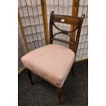 A 19th century dining chair, upholstered in a pink floral material and supported on turn legs