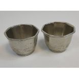 A Pair of English pewter drinking cups in and oriental manner