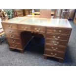 Antique writing desk, three section leather top above two-handled central drawer, flanked by