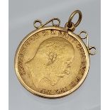 1910 Half Sovereign coin encased with a 9ct gold pendant holder.