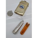 A Birmingham silver cheroot holder containing a amber and 9ct gold cheroot, White metal locket and