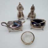 5 Various silver hallmarked condiment pots and cruets together with three silver spoons.