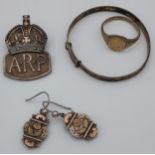 A London silver A.R.P. Badge, silver baby bangle, silver earrings and 9ct & silver signet ring.