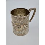 A Victorian Glasgow silver raised relief trophy cup. Presented to Tom Henry Ballantyne 1884. [122.