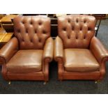 Brown leather upholstered arm chairs, straight button back, supported on front turned supports