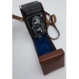 A Vintage Rolleiflex camera with Carl Zeiss lens.
