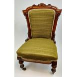 19th century chair, carved scroll surround, green upholstered cushioned seat and back, raised on