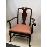Georgian chair with a central splat, scroll arm rests upon turned legs and pad feet. [