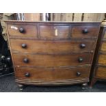 A Georgian/ Victorian bow-front chest of drawers, three small drawers over three long drawers with
