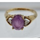 A Ladies 9ct gold, diamond and amethyst stone ring. [2.74grams],[1.7mm Diamonds] [9x6.9mm- purple