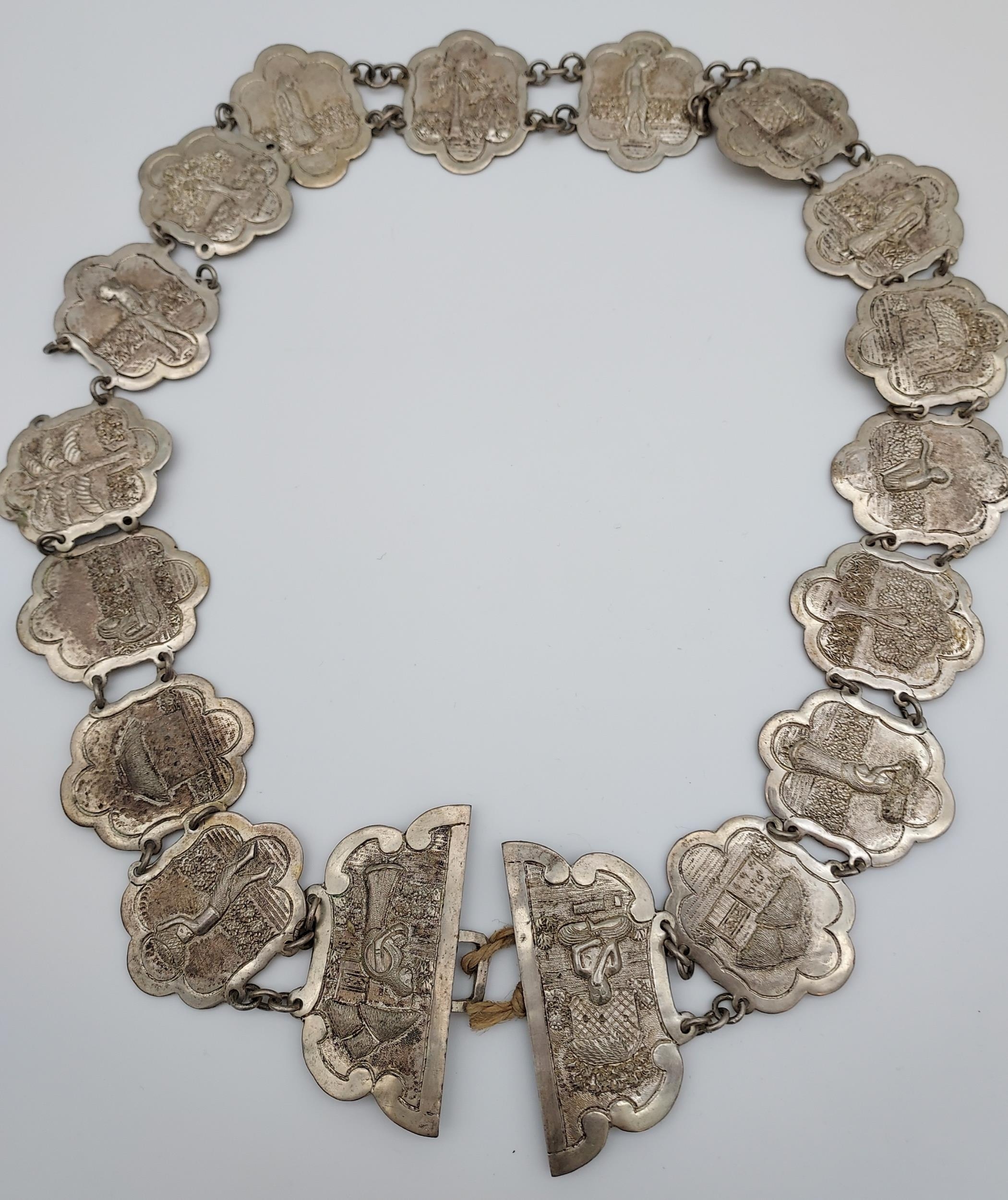 An Indian ornate silver belt. [206.90grams] - Image 2 of 7