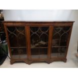 Antique Mahogany 3 section glass door, low breakfront bookcase supported on bracket feet (Shelves