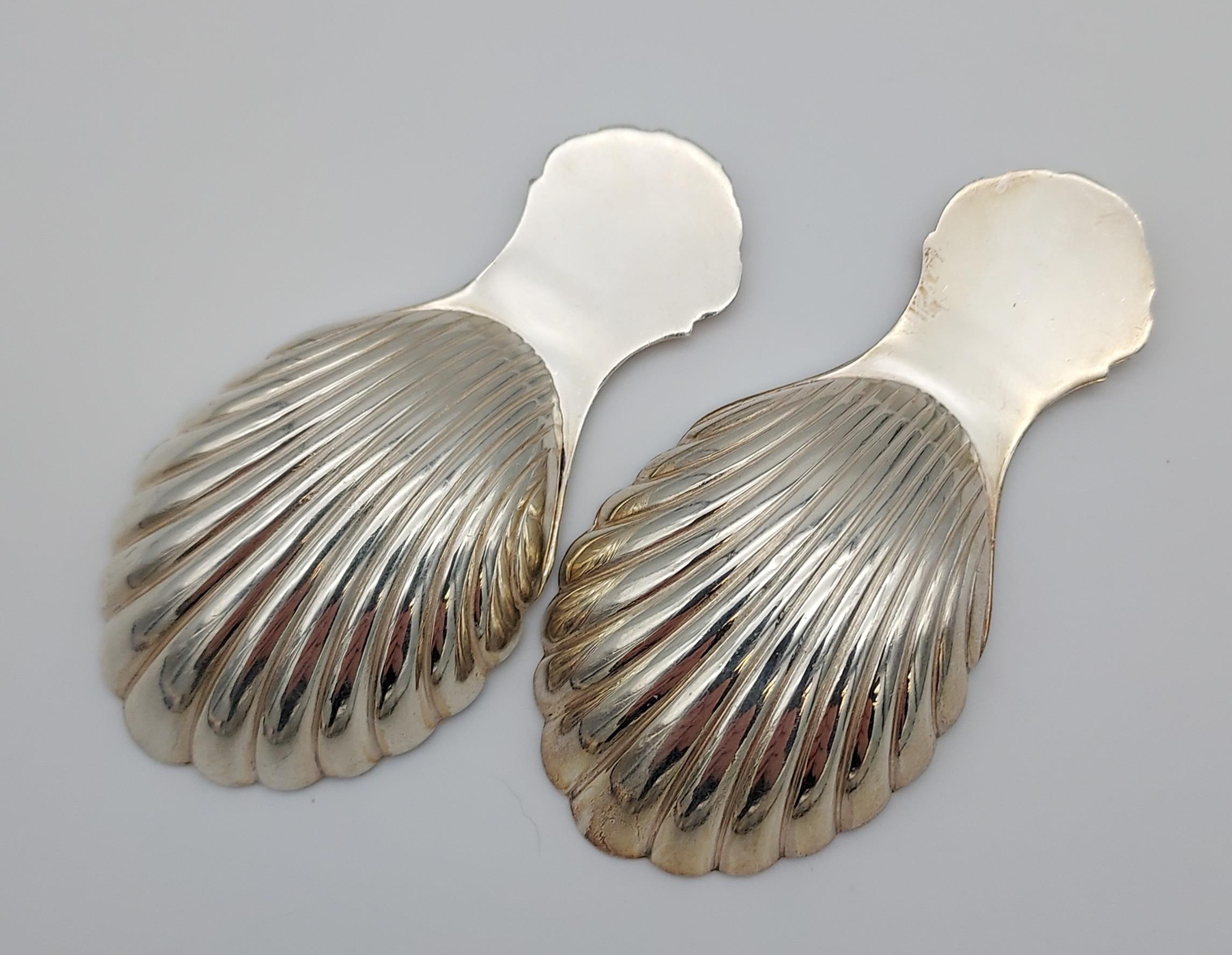 Two Birmingham silver caddy spoons, scalloped designs. [8cm in length] [42.19grams] - Image 2 of 2