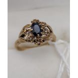 A Ladies 9ct gold, single sapphire and diamond ring. [Ring size K] [2.51GRAMS]