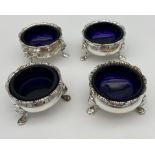 A Lot of four London silver mustard pots with blue liners. [252grams- without liners]