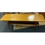 A Mid century teak Danish two tier coffee table. [44x148x50cm] Possibly Gustav Bahus.